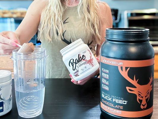 a person scooping collagen and protein powder in a mixing bottle with water.