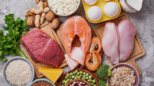image of fresh meat, seafood, eggs, nuts, cheese and some grains.